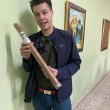 Owner of Cigar Emperor Matthew holding a huge cigar