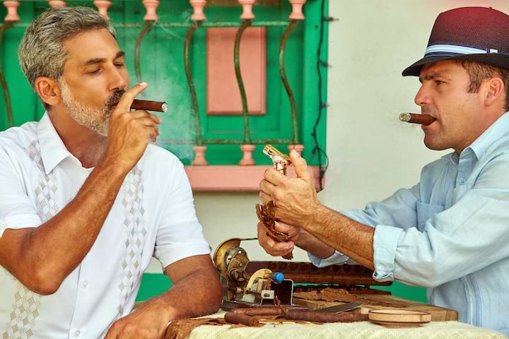 men smoking cigars in cuba